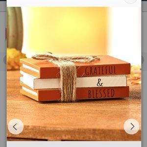 Inspirational stacked wooden books